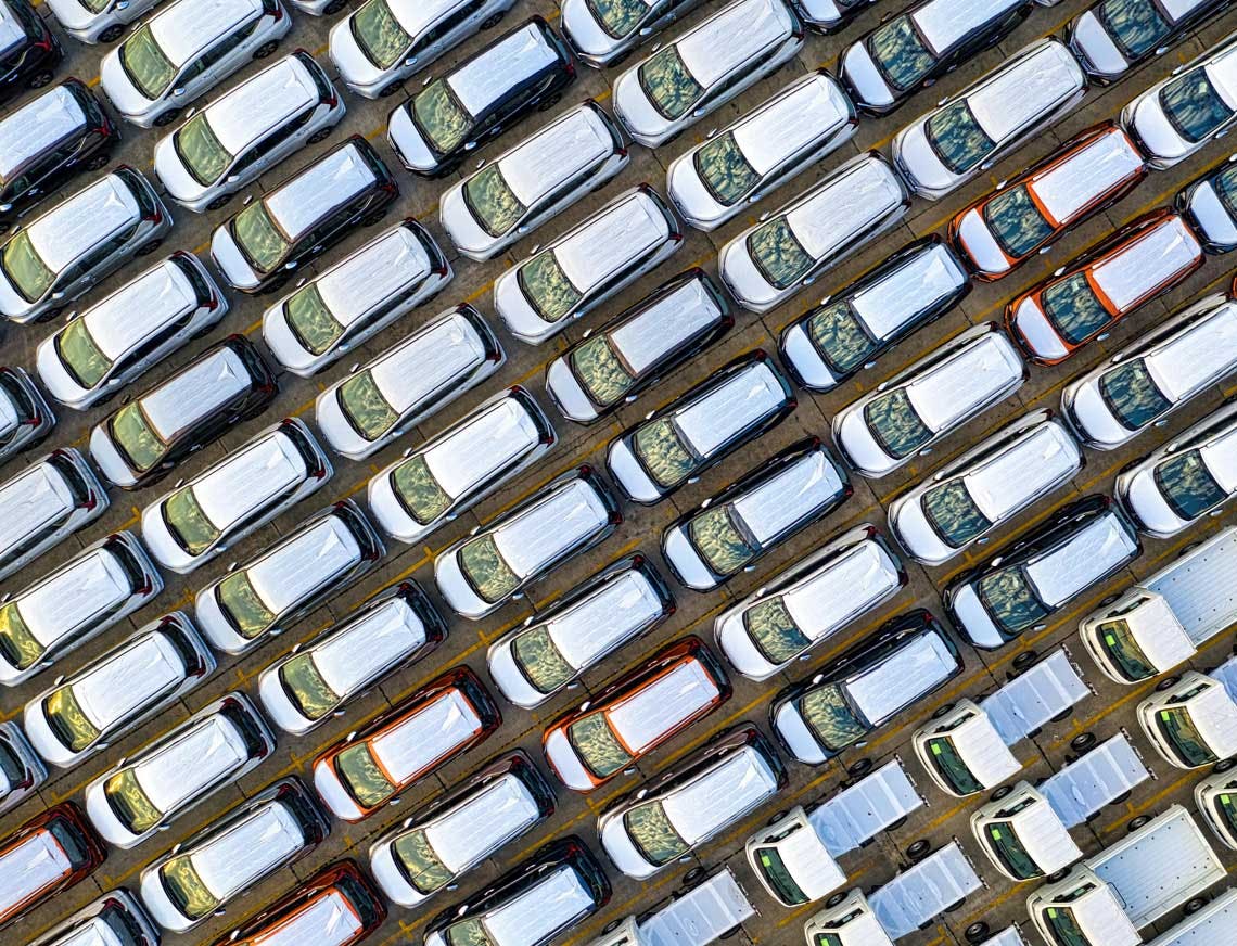 Cars in a parking lot photographed from the sky