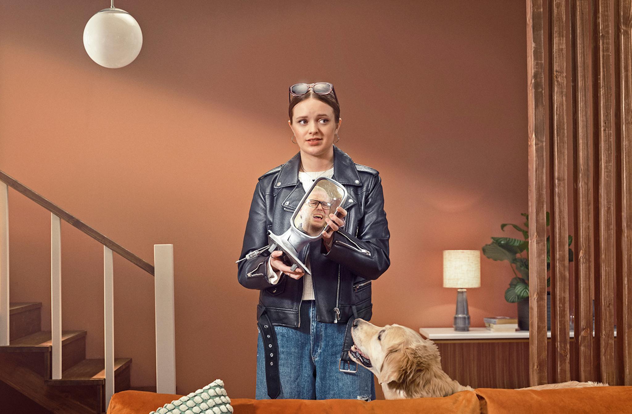 Woman holding a detached car side mirror